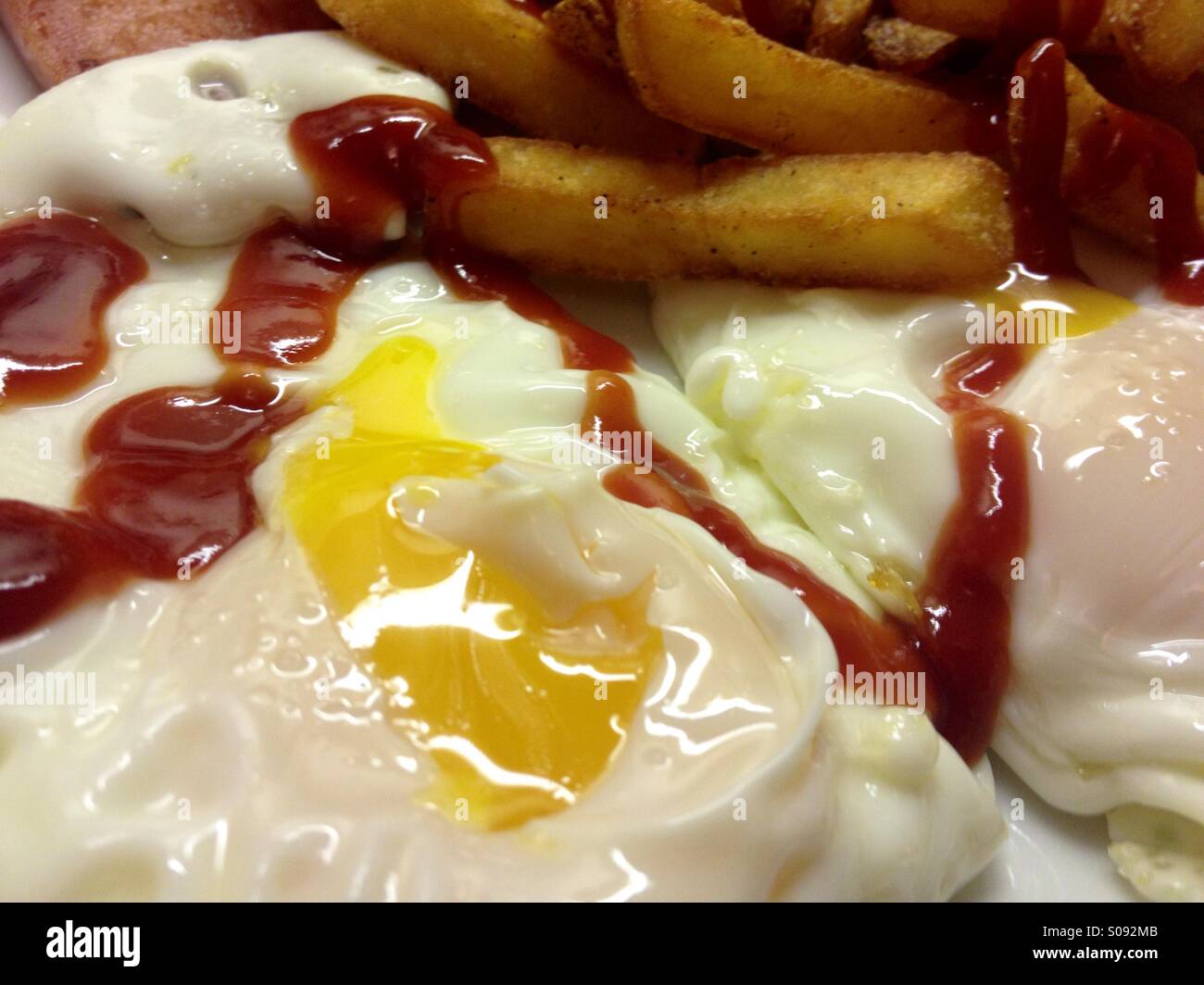 Two fried eggs and chips with tomato ketchup Stock Photo Alamy