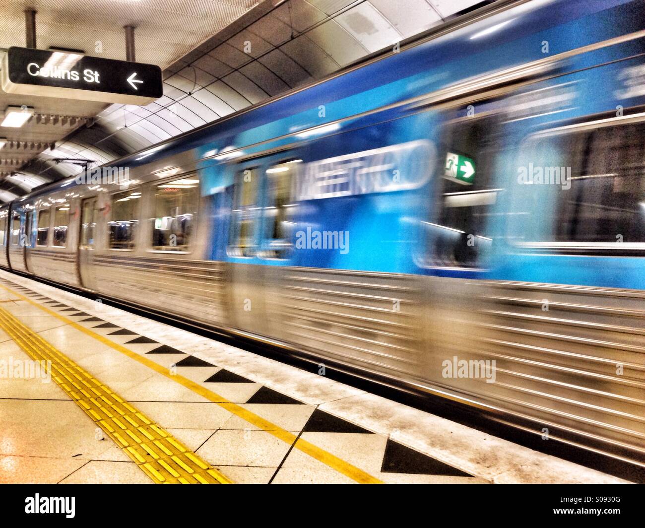 Underground train leaving Parliament station in Melbourne, Victoria, Australia. - Smartphone Captured Stock Image