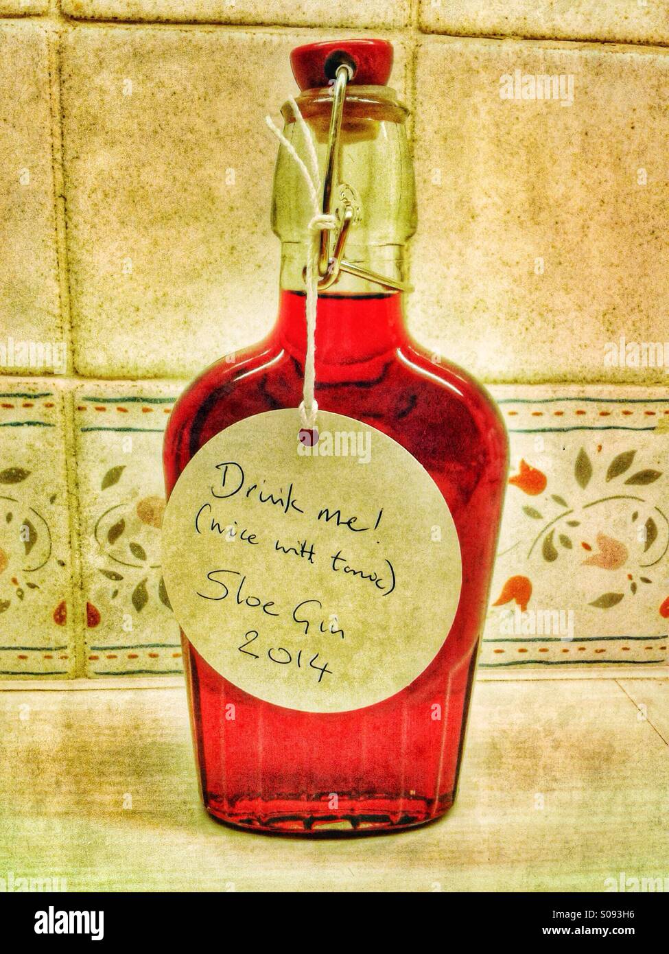 Sloe Gin in a bottle Stock Photo