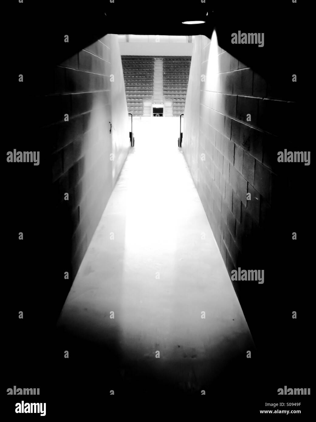 Tunnel leading to spectator area of hockey arena. - Smartphone Captured Stock Image