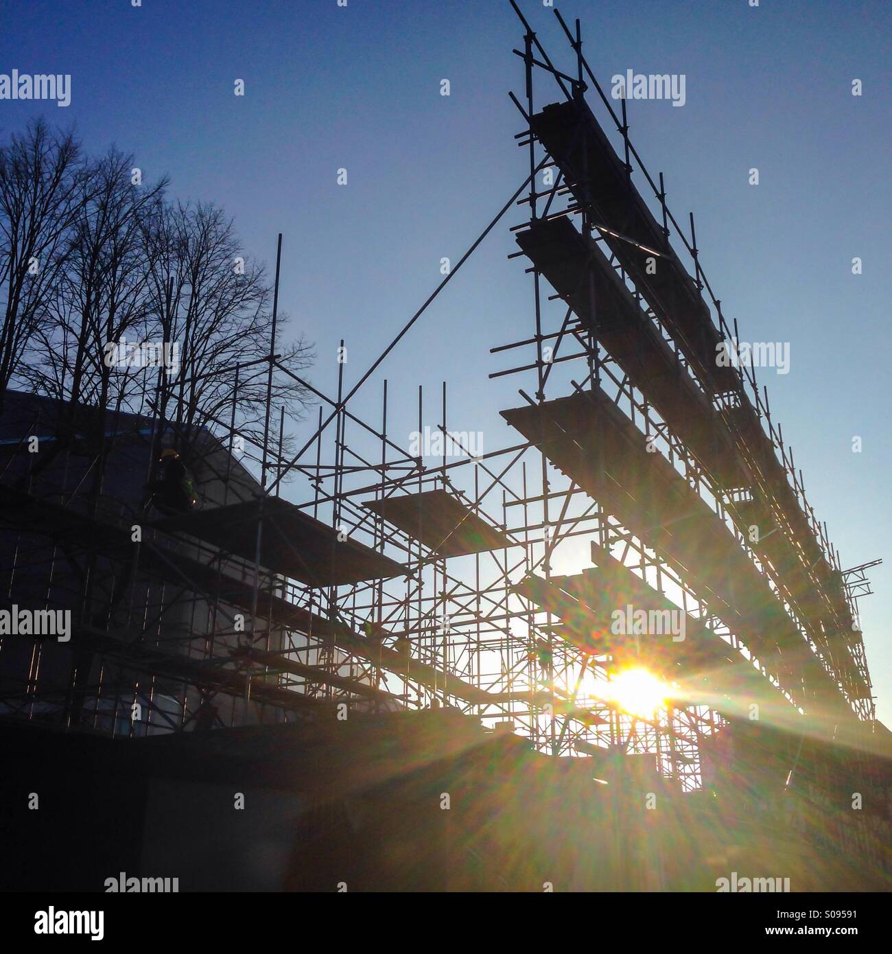Sun glare through scaffolding in Canterbury, Kent - Smartphone Captured Stock Image