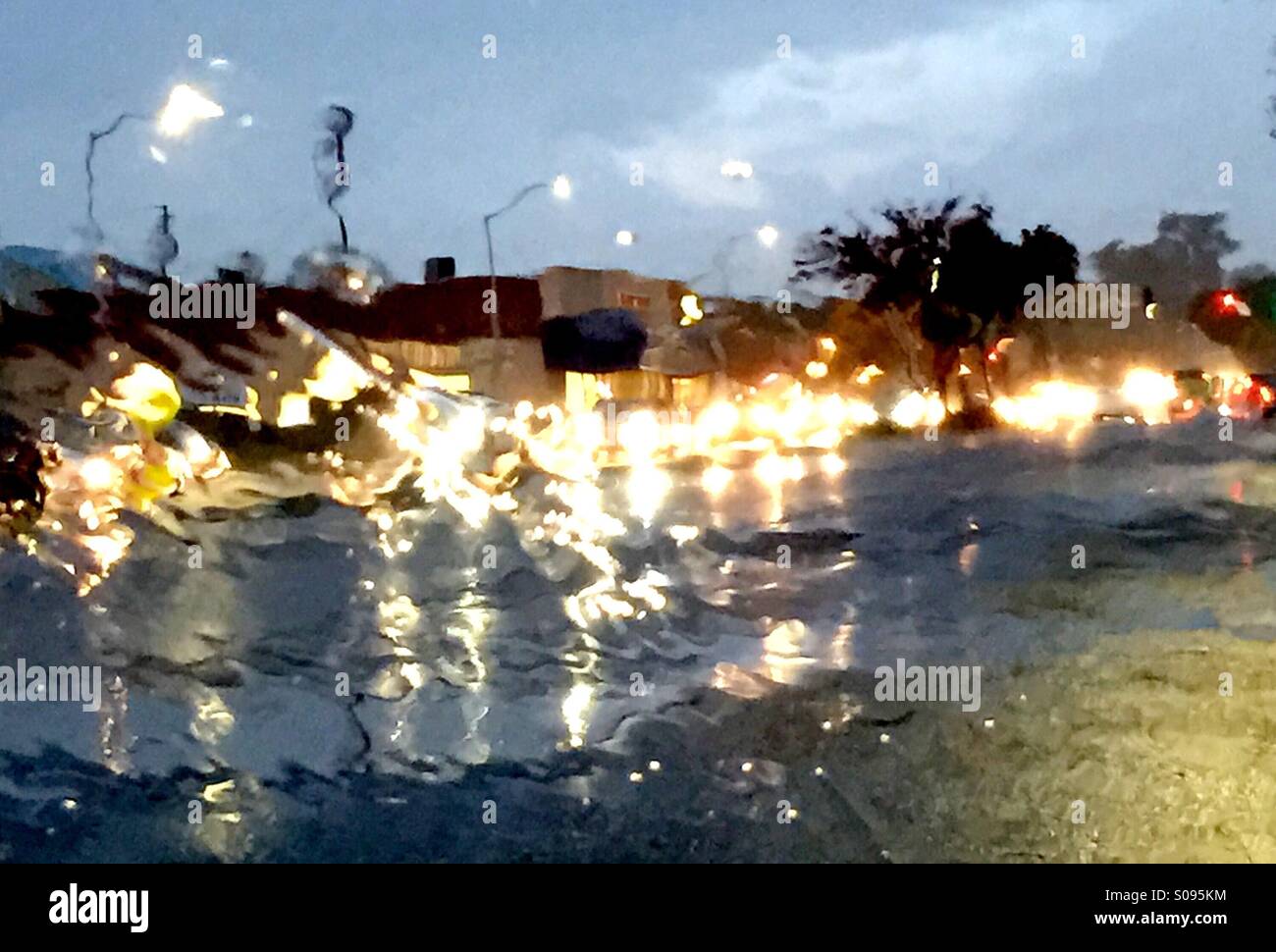 Car headlights through wet windshield - Smartphone Captured Stock Image