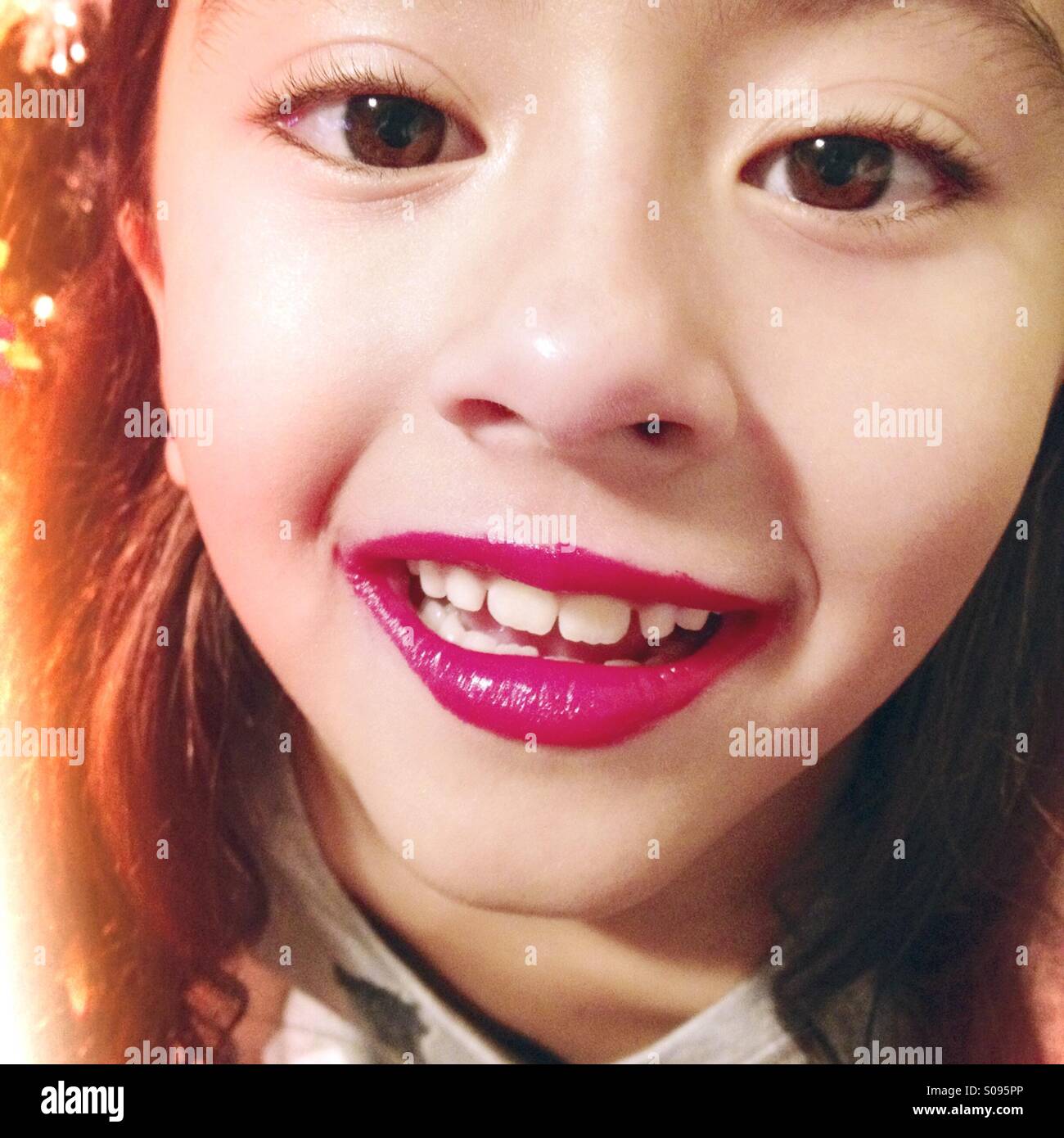 Little girl with messy lipstick and beautiful eyes Stock Photo Alamy