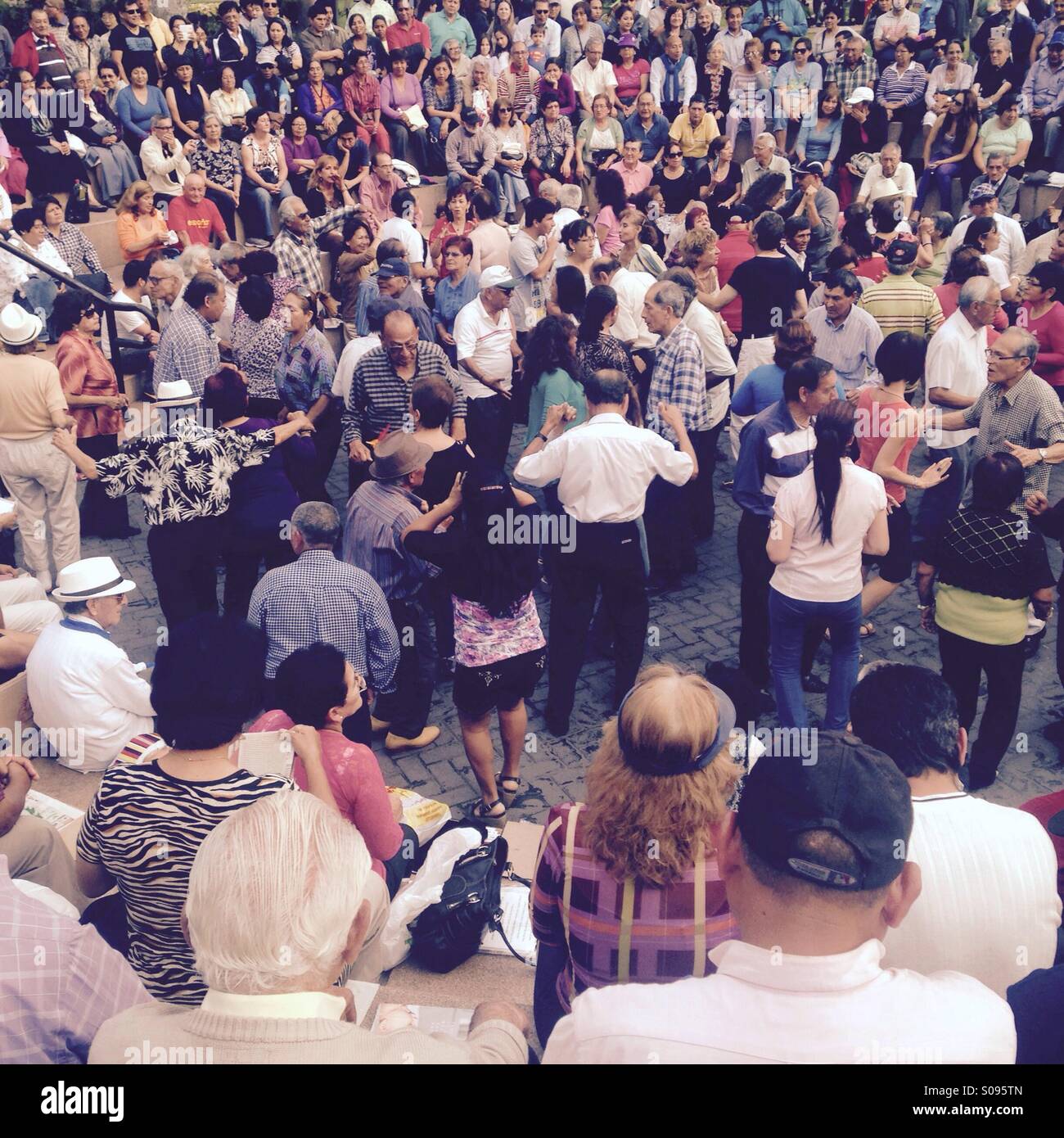 People dancing at Parque Kennedy in Miralflores - Smartphone Captured Stock Image