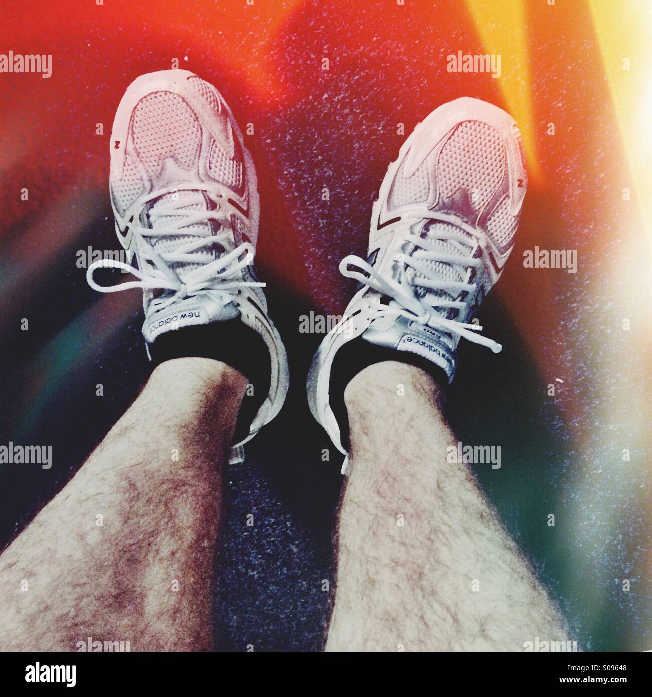 Mans legs in running trainers shoes - Smartphone Captured Stock Image