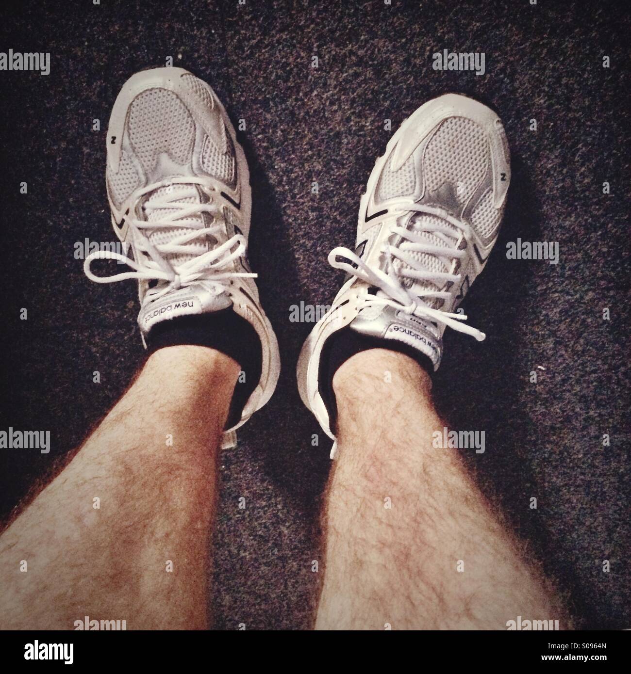 Male legs in running shoes - Smartphone Captured Stock Image