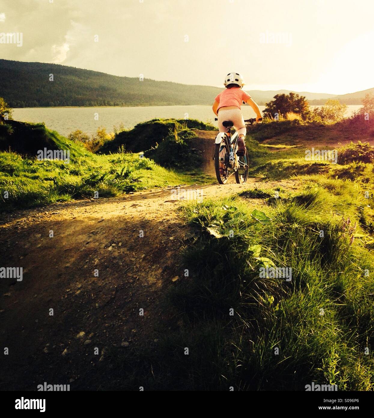 Girl riding a bike, Åre, Sweden. MR available - Smartphone Captured Stock Image