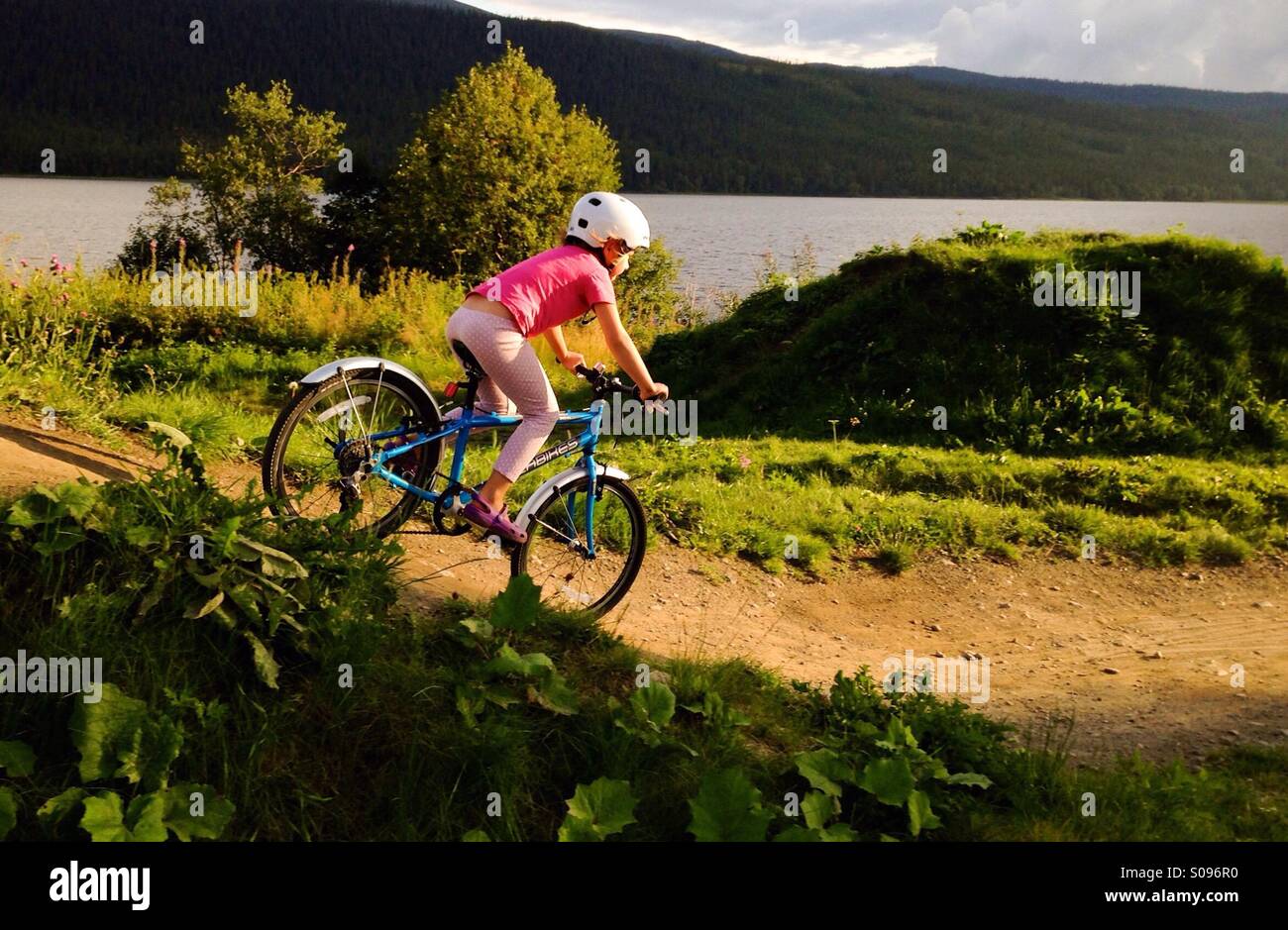 Girl riding a bike, Åre, Sweden. MR available - Smartphone Captured Stock Image