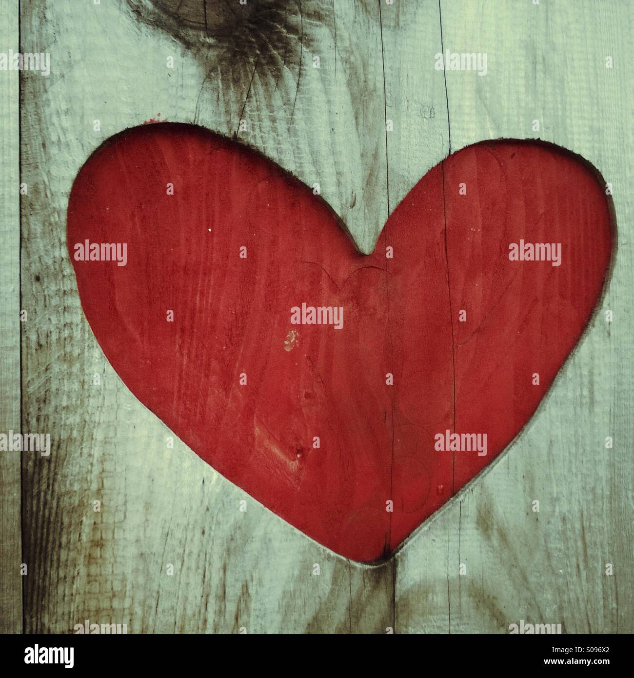 Red Valentines love heart shape in rustic wood Stock Photo