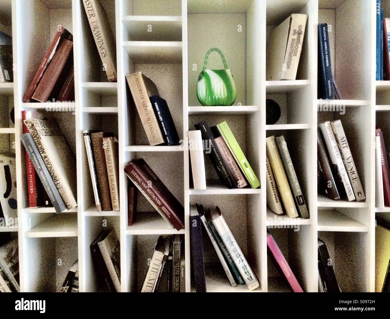 Bookshelf in modern design in boutique hotel, Postcard Inn, St Petes Beach, Florida - Smartphone Captured Stock Image