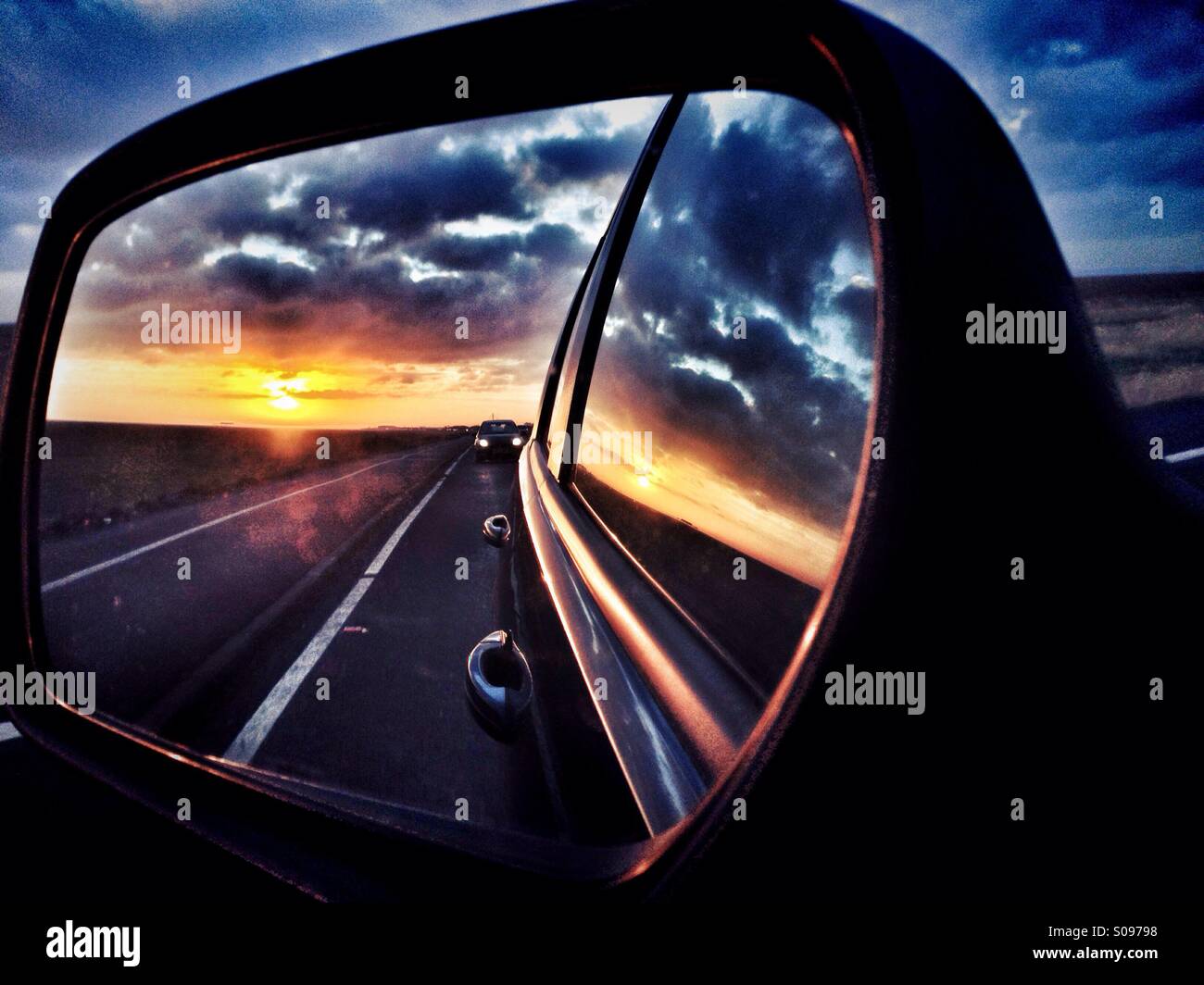 Sunset in car side mirror Stock Photo Alamy