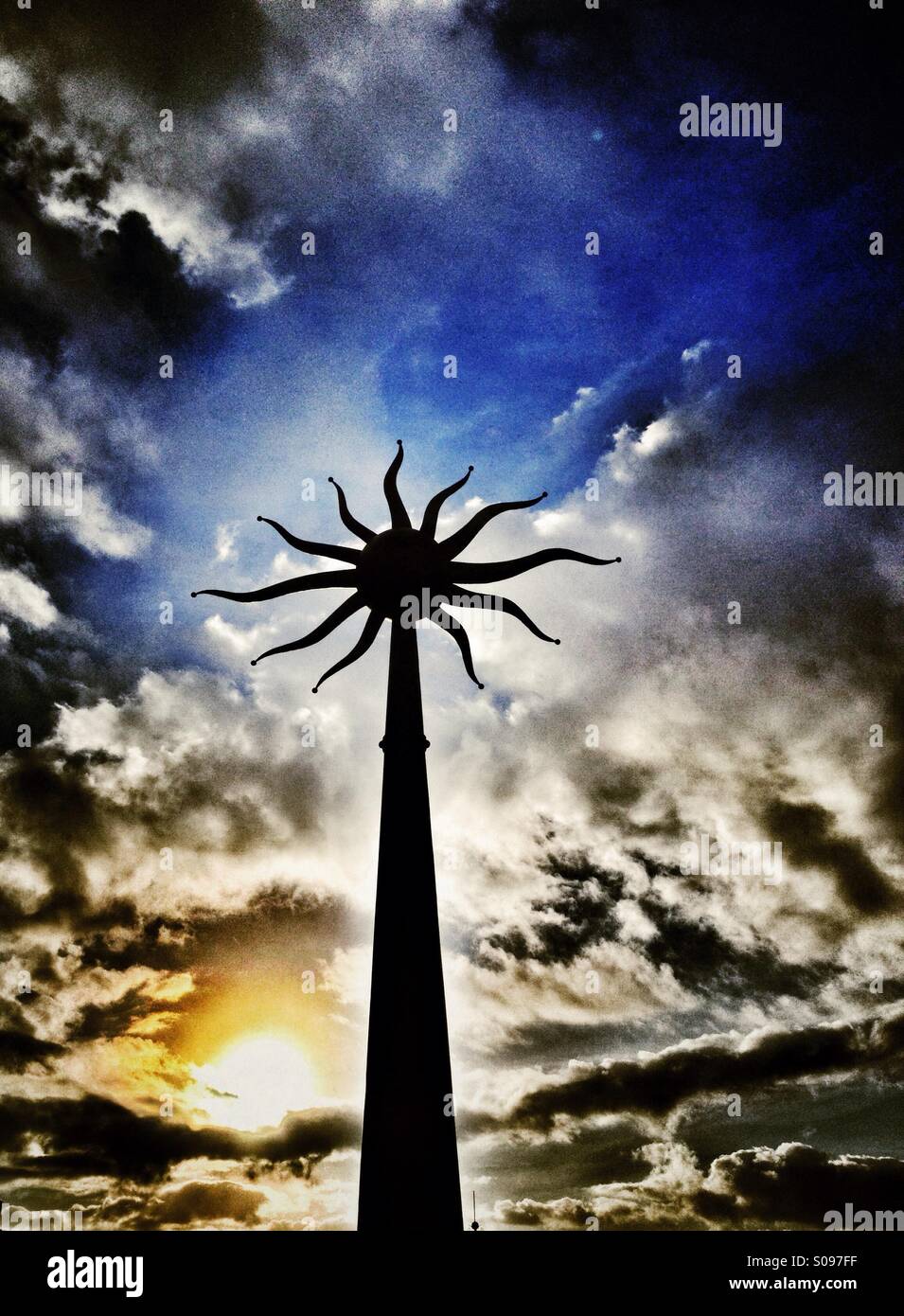 Sculpture of sun against sun and dramatic sky - Smartphone Captured Stock Image
