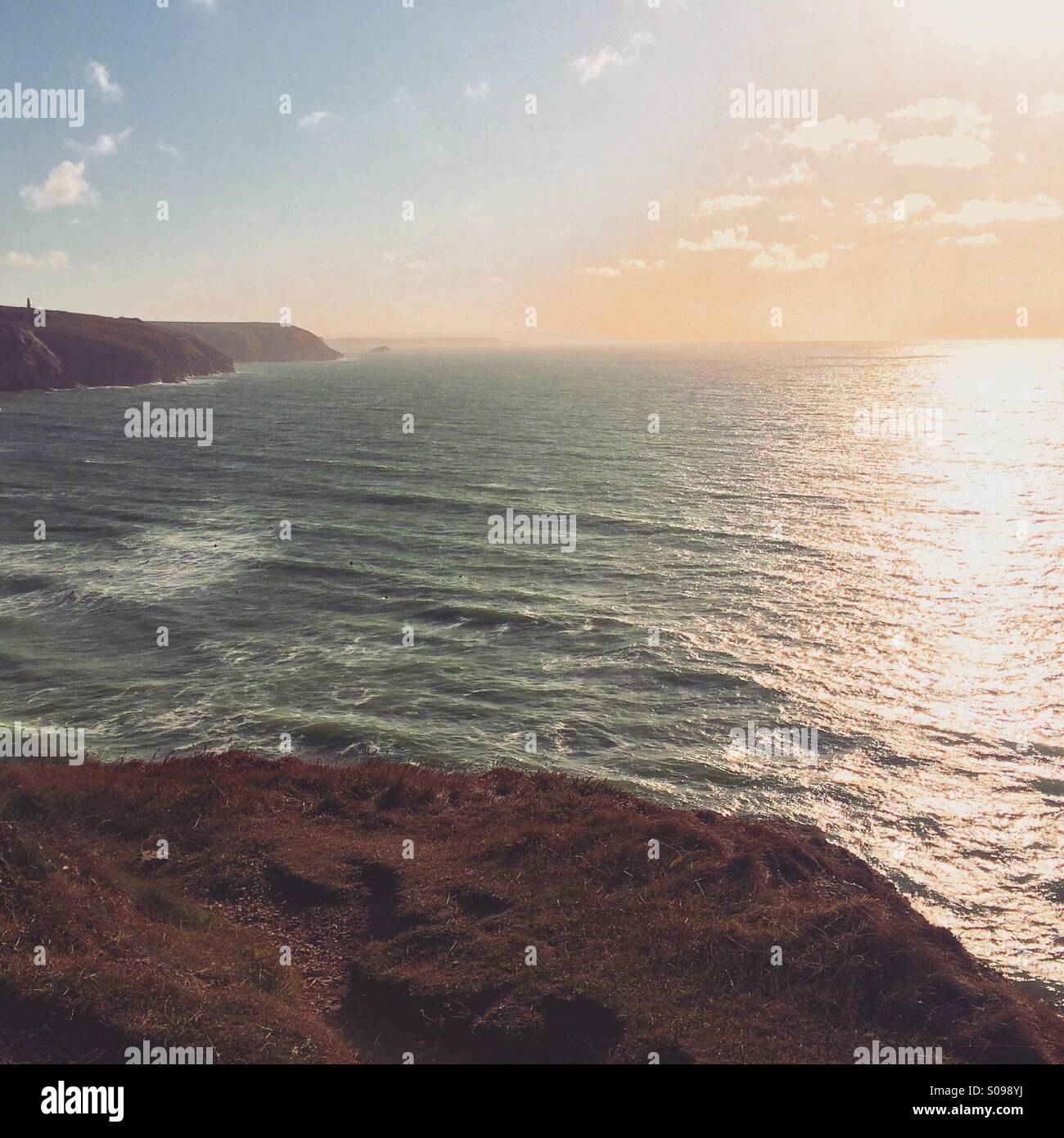 The sun setting on a calm sea, Cornwall - Smartphone Captured Stock Image