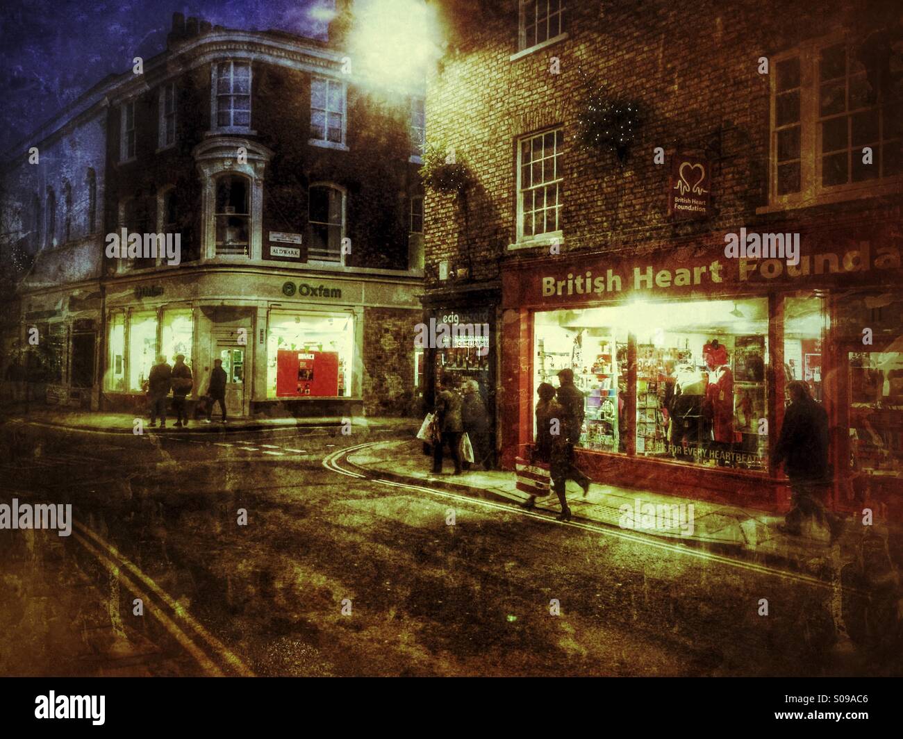 Shopping street at night in Cold wet weather York North Yorkshire England UK - Smartphone Captured Stock Image