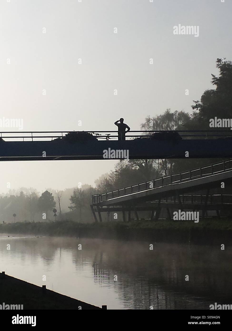 Man looping over misty water Stock Photo