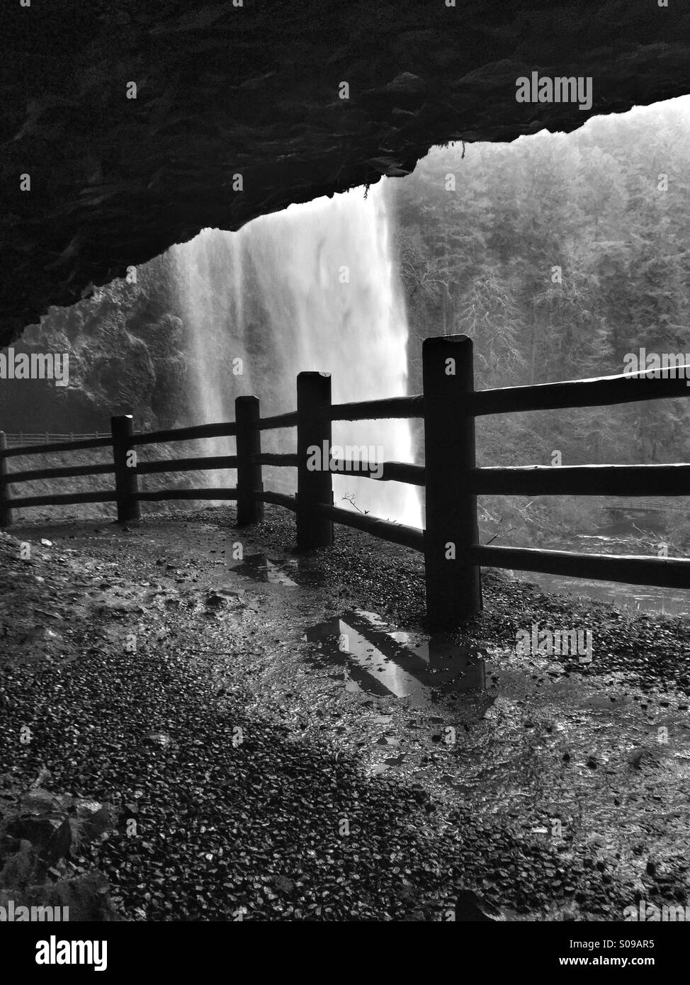 Black and white scene under a waterfall Stock Photo Alamy