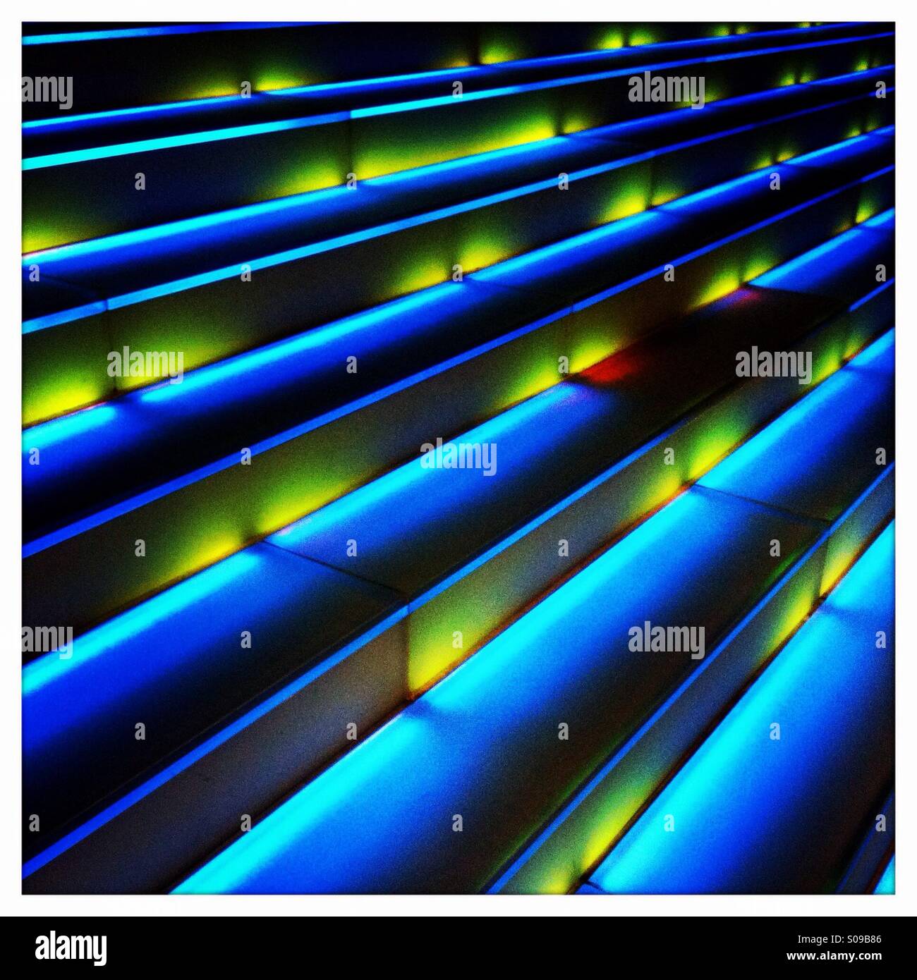 Blue and yellow lights with stairs Stock Photo Alamy