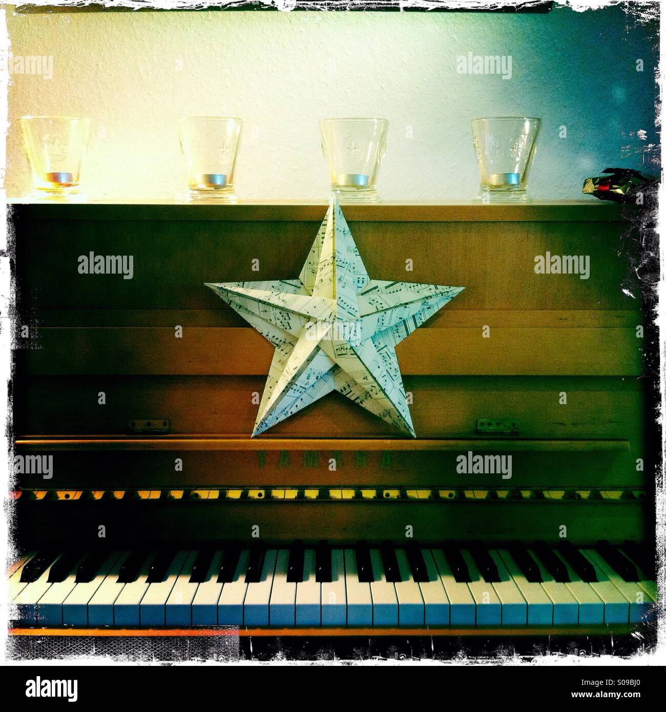 Christmas star on piano. - Smartphone Captured Stock Image