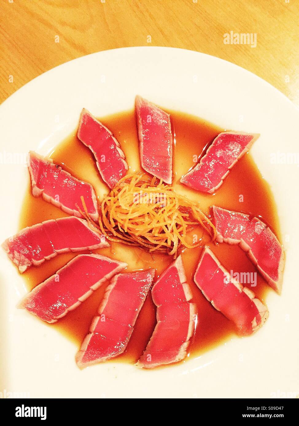 Japanese tuna tataki with ponzu sauce appetizer on a table in a restaurant Stock Photo Alamy