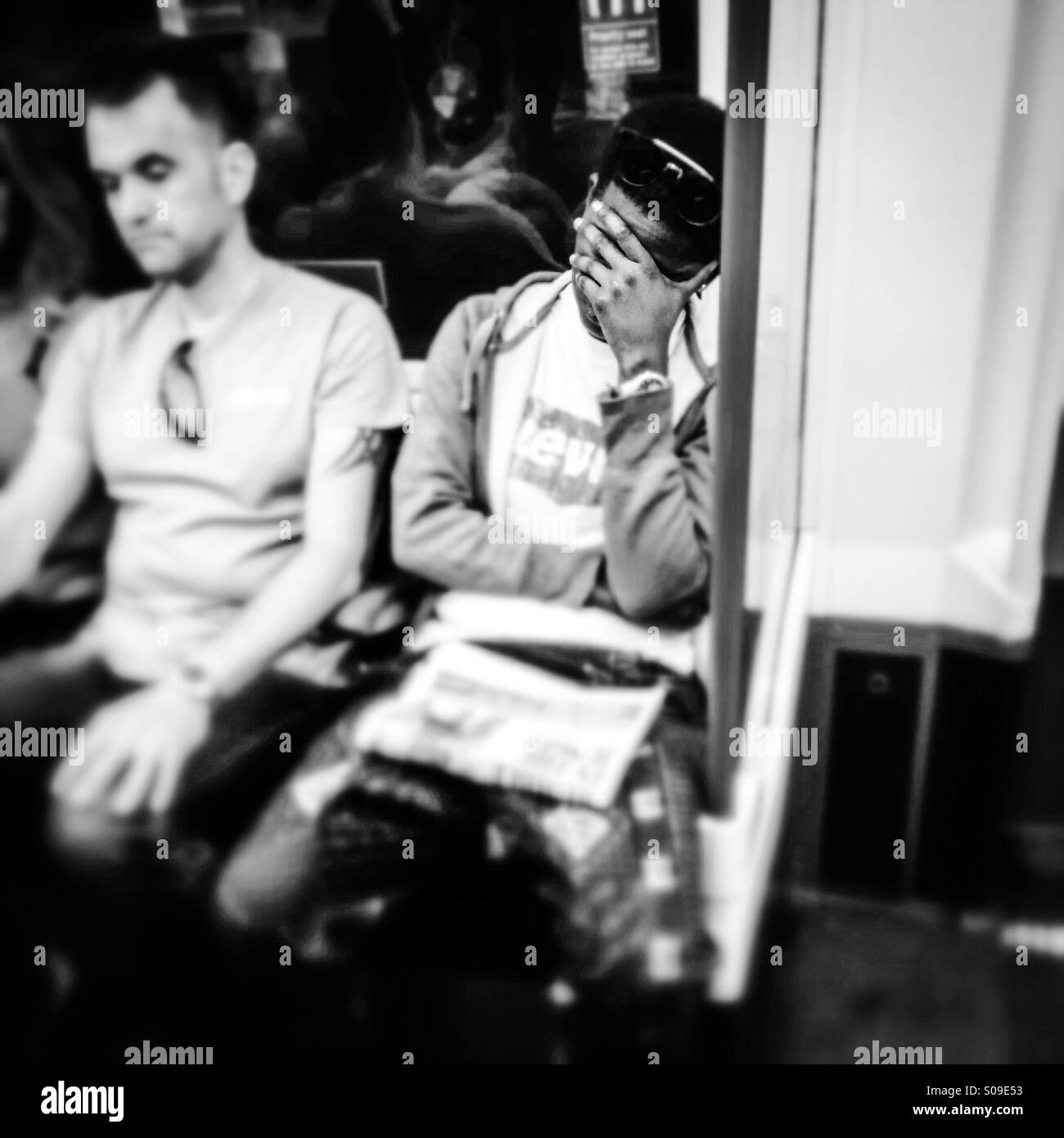 Man sleeps on London Underground Tube train - Smartphone Captured Stock Image