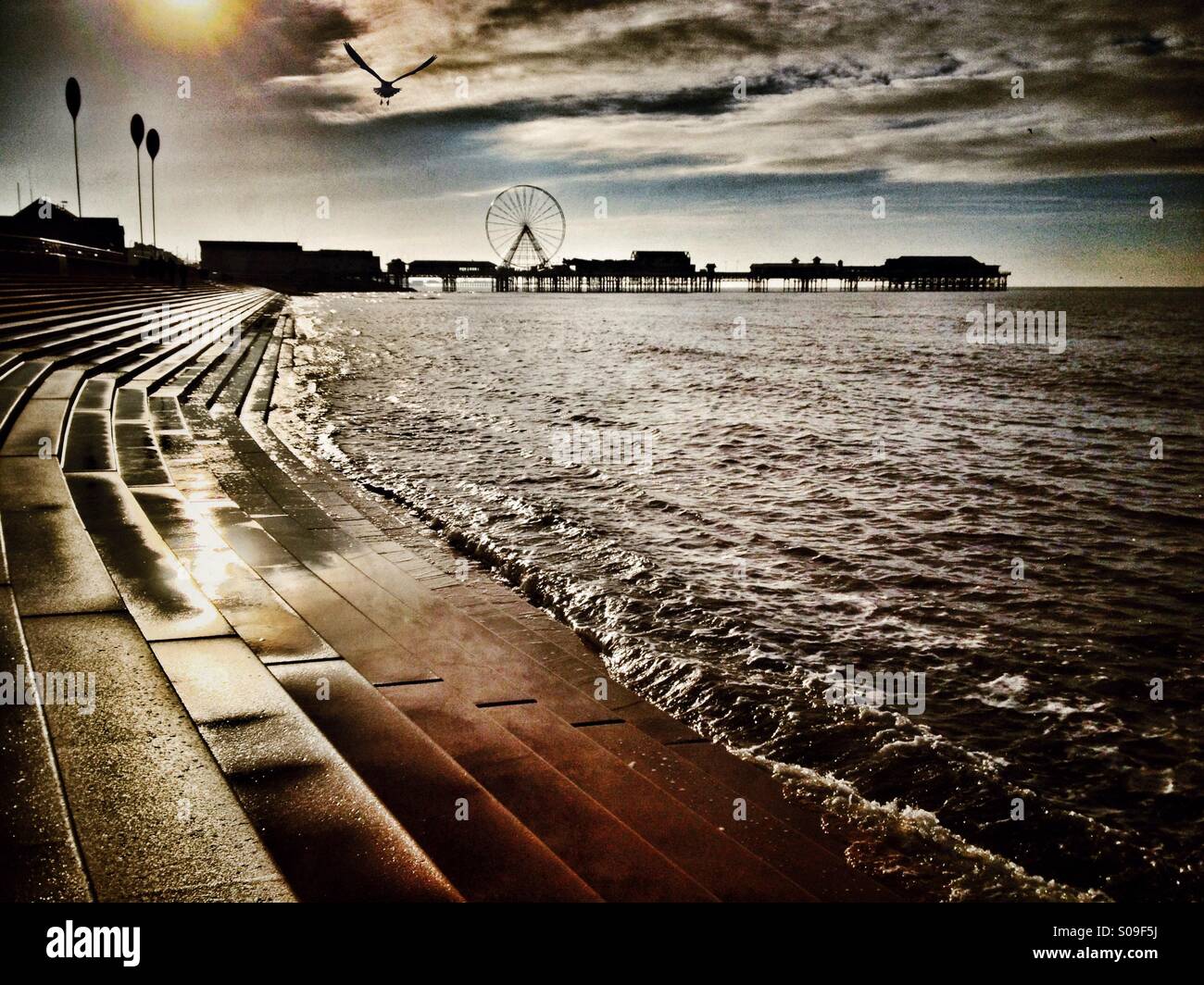 Blackpool seafront and central pier at high tide in winter - Smartphone Captured Stock Image