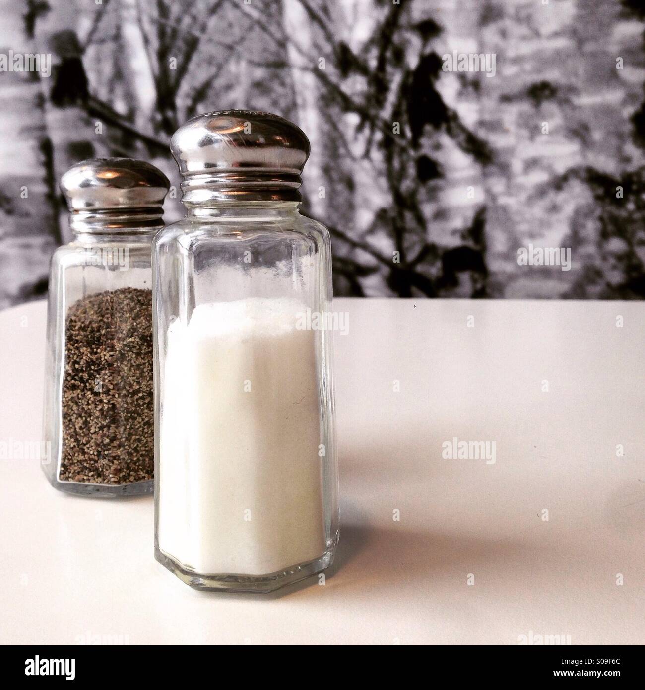 Salt and pepper shakers on light grey table, closeup. Space for text Stock  Photo - Alamy