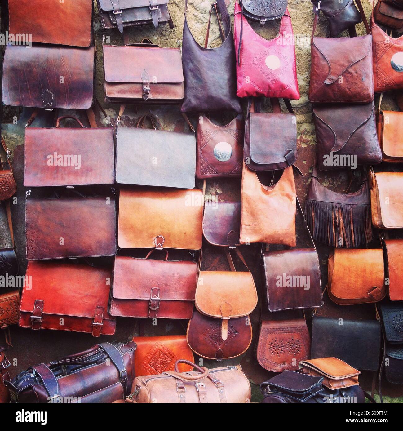 Leather bags for sale in the souk of Essaouira, Morocco. Stock Photo