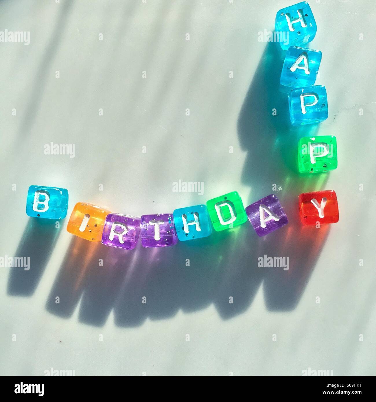 Happy birthday in little letters in sunlight Stock Photo
