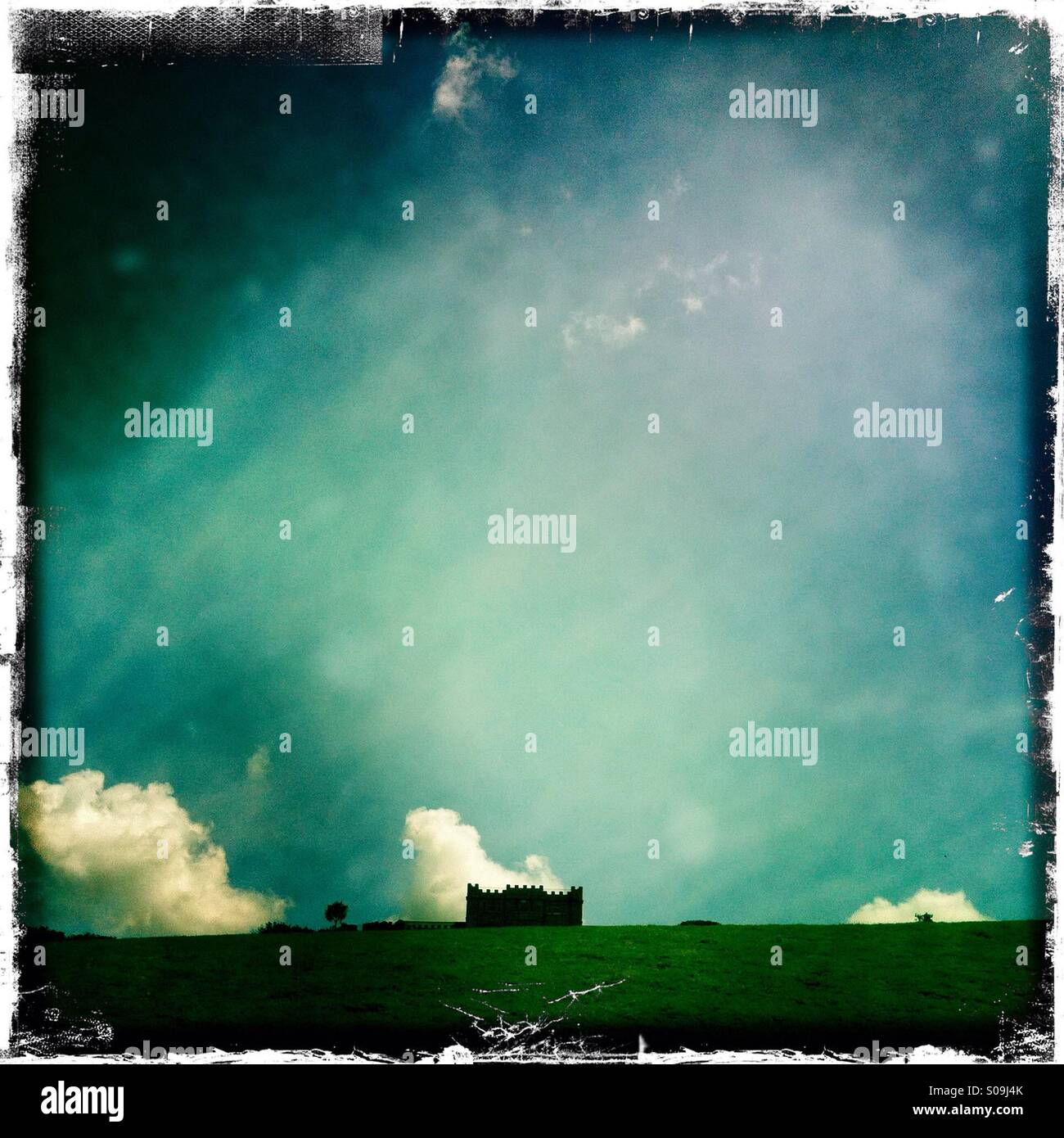 Hillside cottage with blue sky. - Smartphone Captured Stock Image