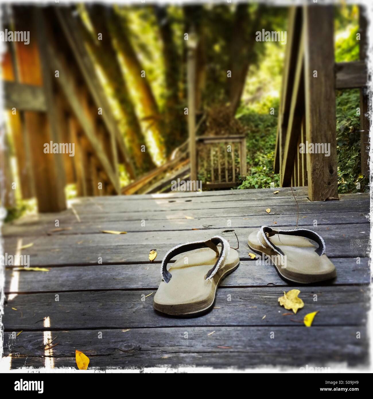 Sandals on a wooden deck. - Smartphone Captured Stock Image