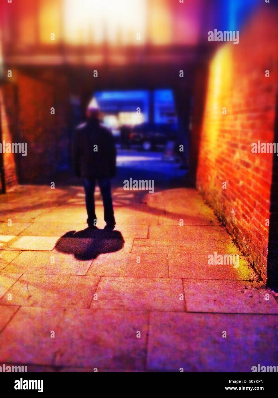 Man standing beneath light - Smartphone Captured Stock Image