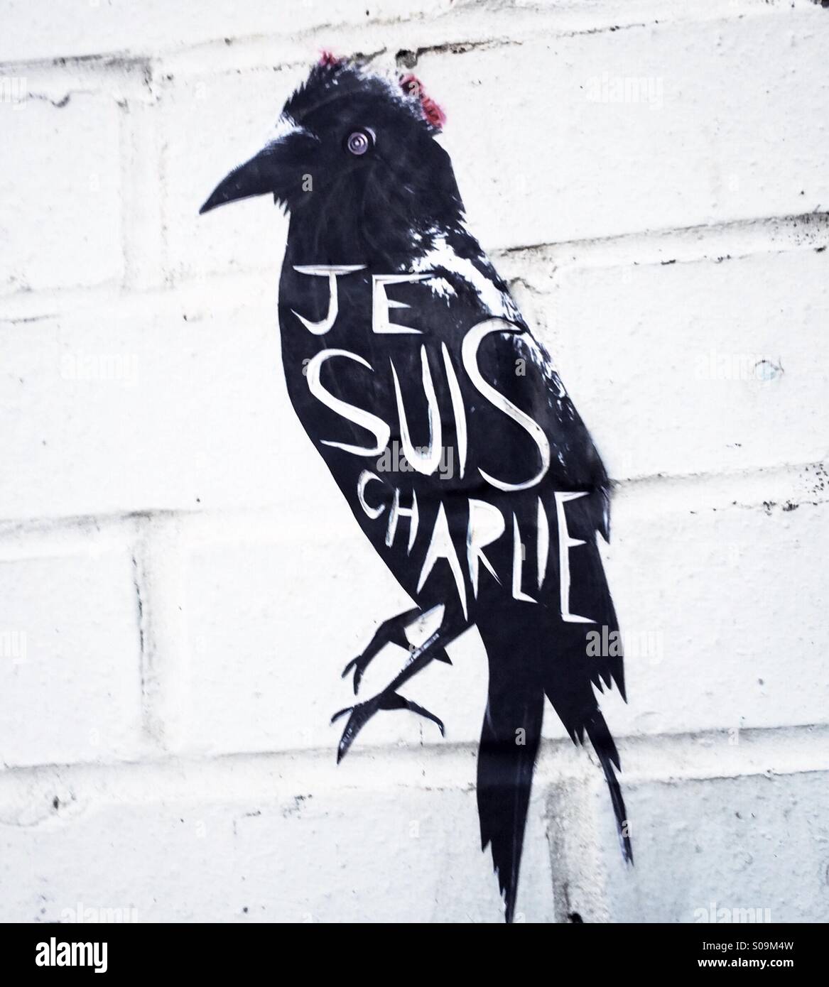 A street art Raven pasteup by artist Alex Ekins with Je Suis Charlie written on it in Sheffield England United Kingdom UK Stock Photo