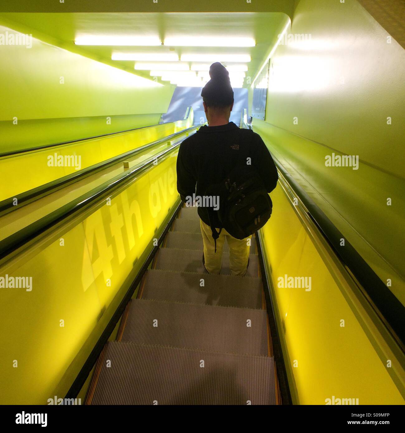 Man on escalator, Seattle Public Library,  designed by Architect Rem Koolhaas, Seattle, Washington Stock Photo