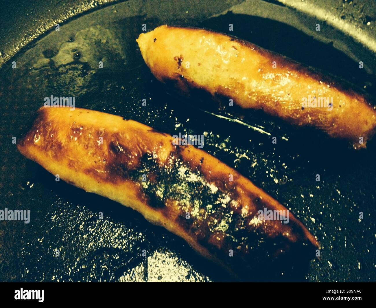 Sausages In Frying Pan Stock Photos & Sausages In Frying Pan Stock