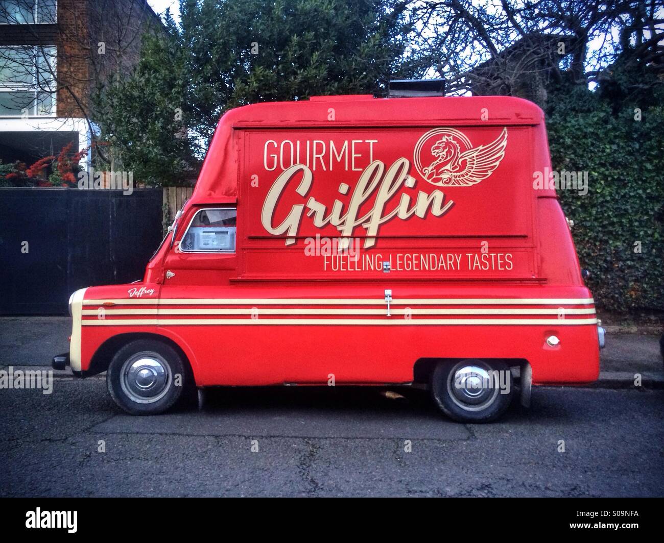 Vintage red Bedford CA van belonging to Gourmet Griffin, the hot dog and street food vendors from North London. Stock Photo