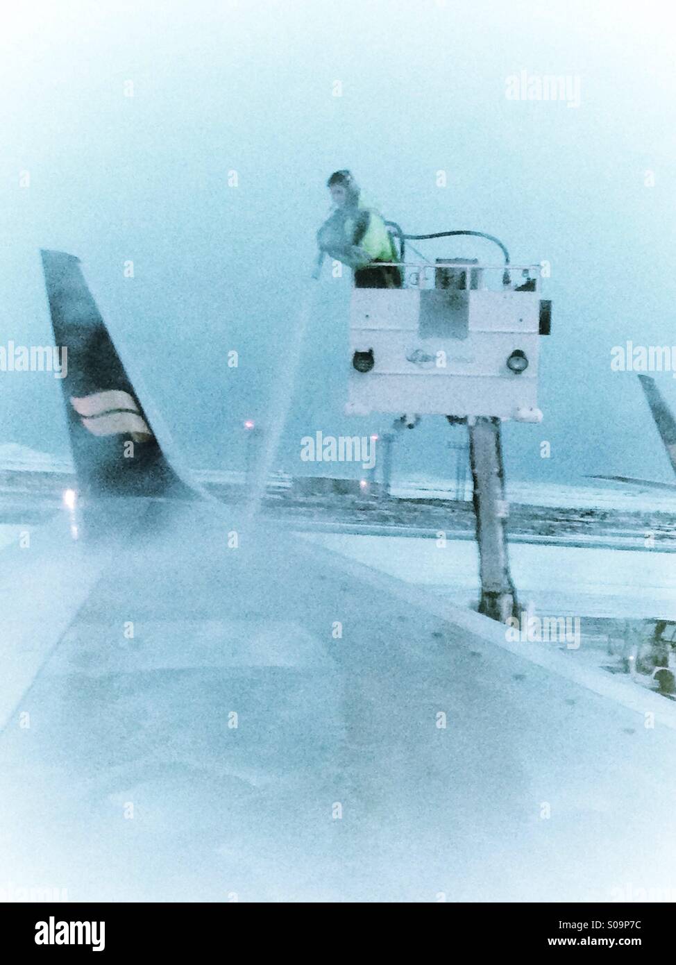 Deicing an Icelandair airplane at Keflavik airport Iceland Stock Photo Alamy