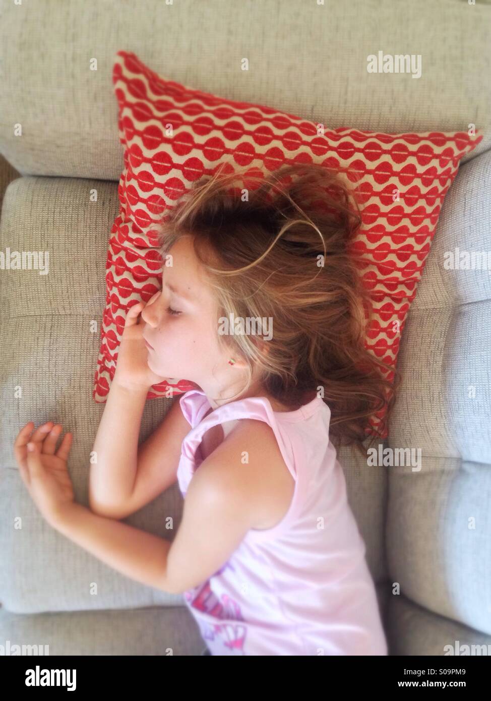 Child fallen asleep on a sofa. - Smartphone Captured Stock Image