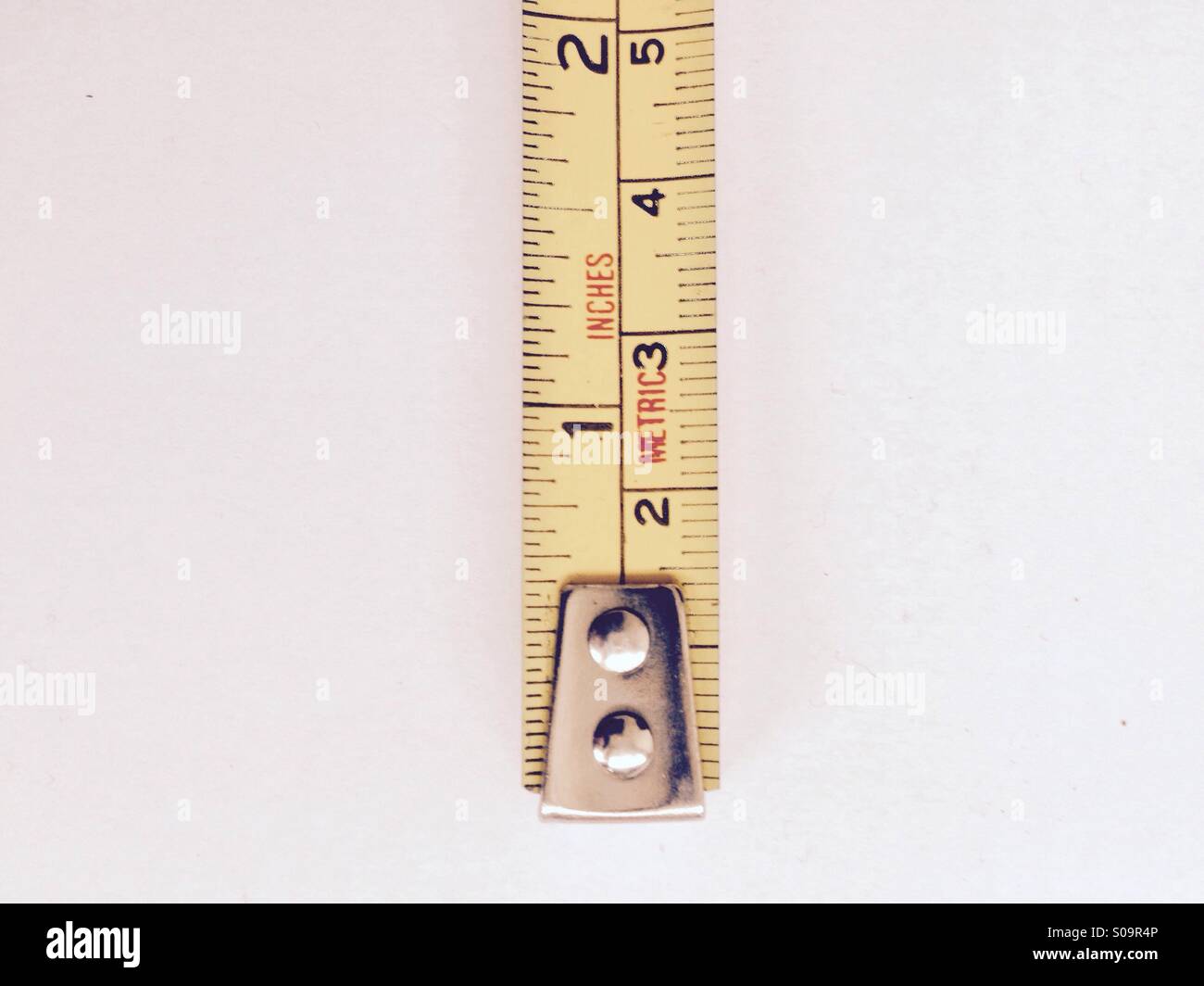 Tape measure in inches & meters Stock Photo