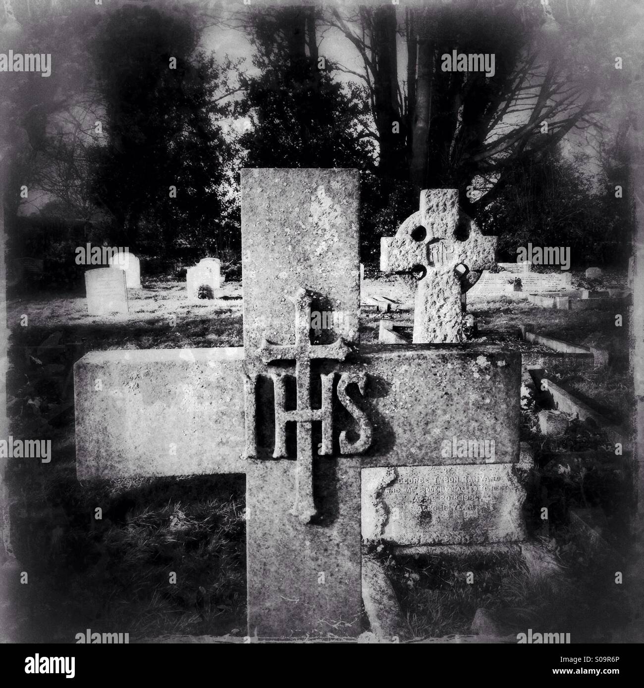 Stone cross headstones in North Rauceby cemetery, Lincolnshire, England. - Smartphone Captured Stock Image