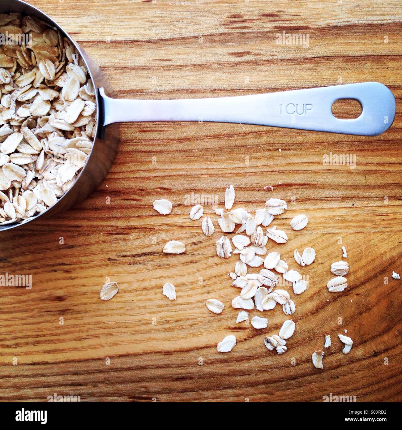 Cup of rolled oats for oatmeal Stock Photo Alamy