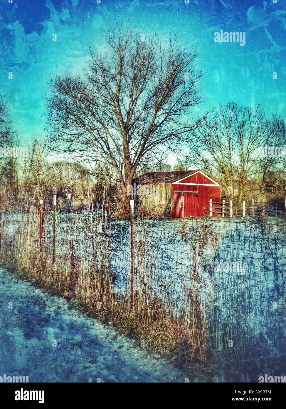 A red barn in the snow Stock Photo - Alamy
