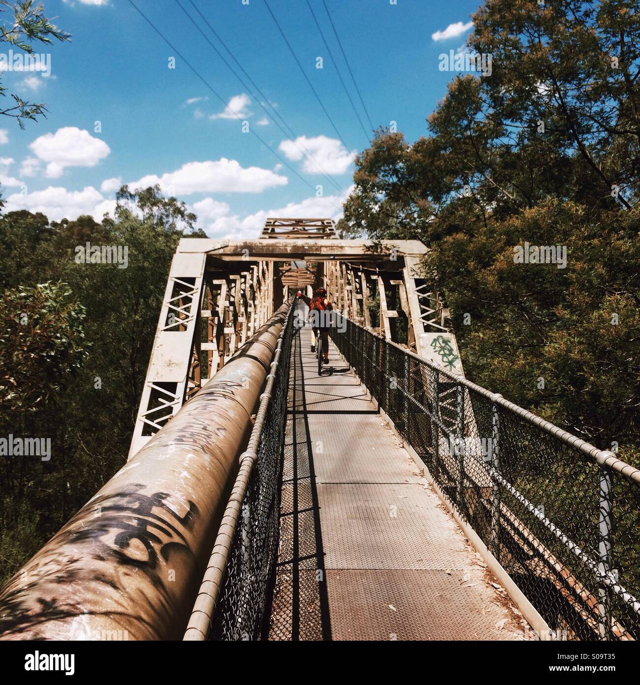 Bike riders on Pipe Bridge, Fairfield Park and Boathouse, Fairfield