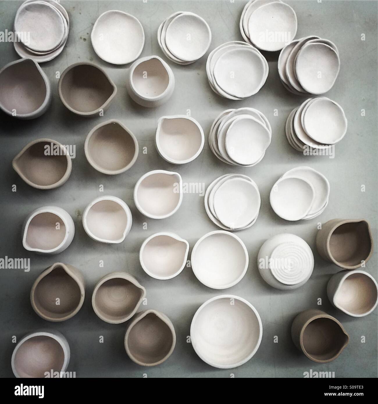 Little pottery bowls and pitchers from overhead Stock Photo