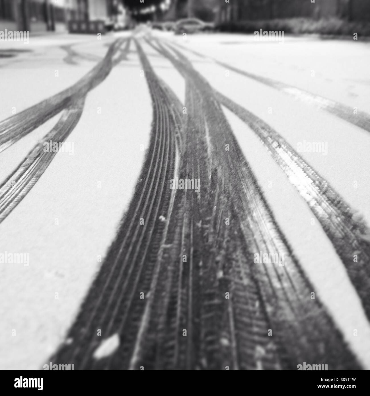 Tyre track marks in snow at a car park in Dublin Ireland Stock Photo