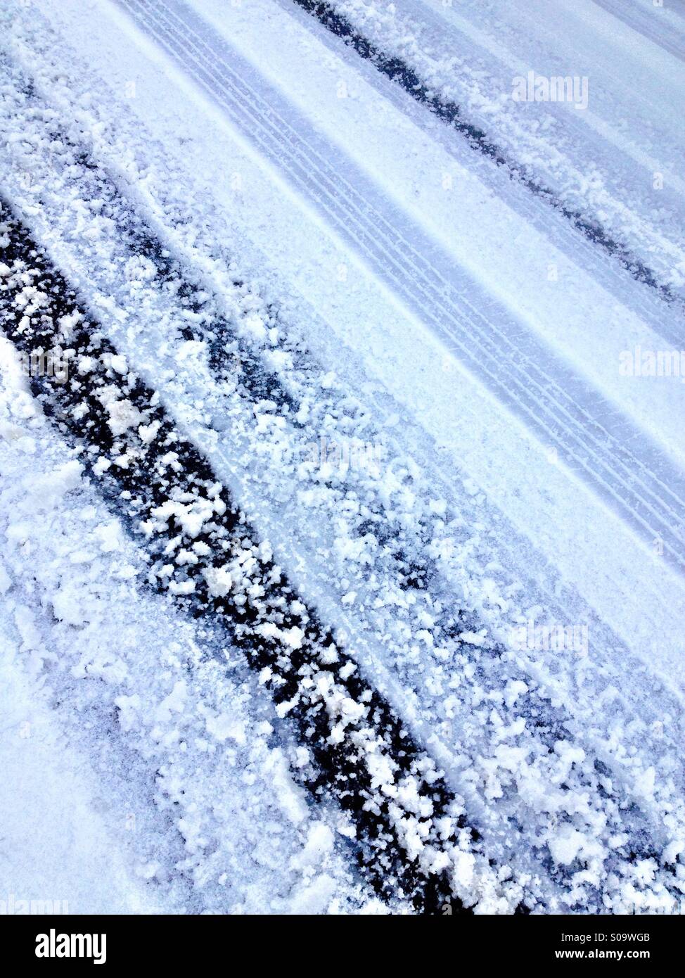 Tyre tracks in Snow - Smartphone Captured Stock Image