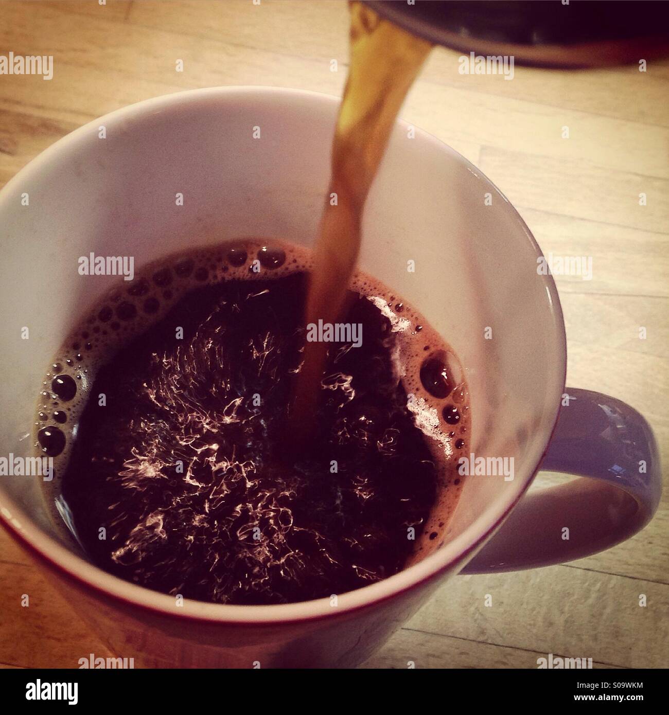Black coffee being poured - Smartphone Captured Stock Image