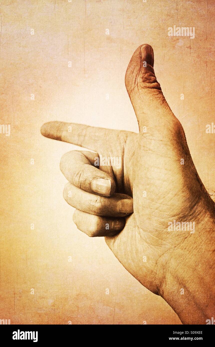 Hand gun ! A pointing finger - Smartphone Captured Stock Image