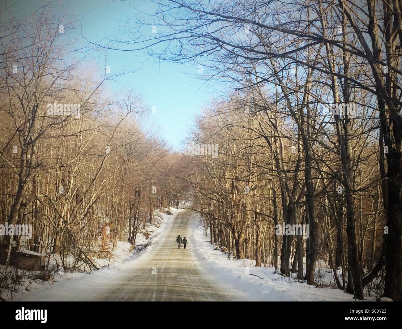 Couple walking up country road near Rutland, Vermont - Smartphone Captured Stock Image