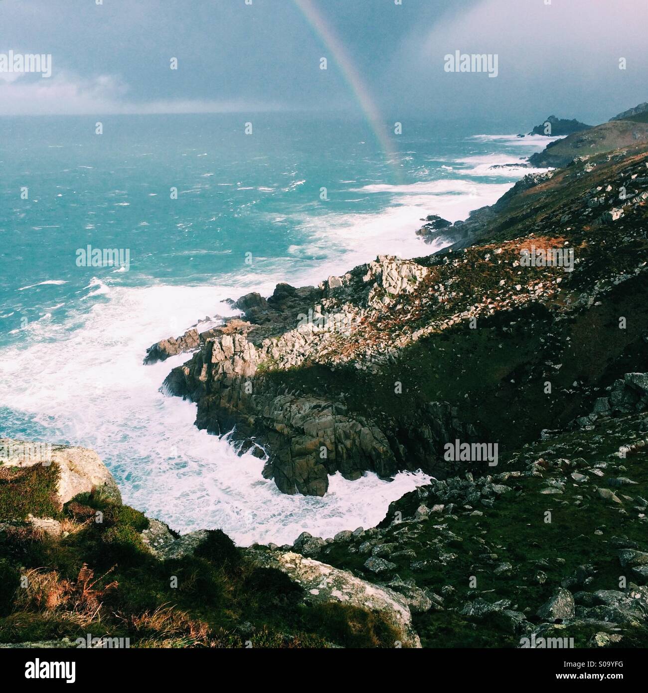 Storm surf and rocky cliffs on the coast Stock Photo