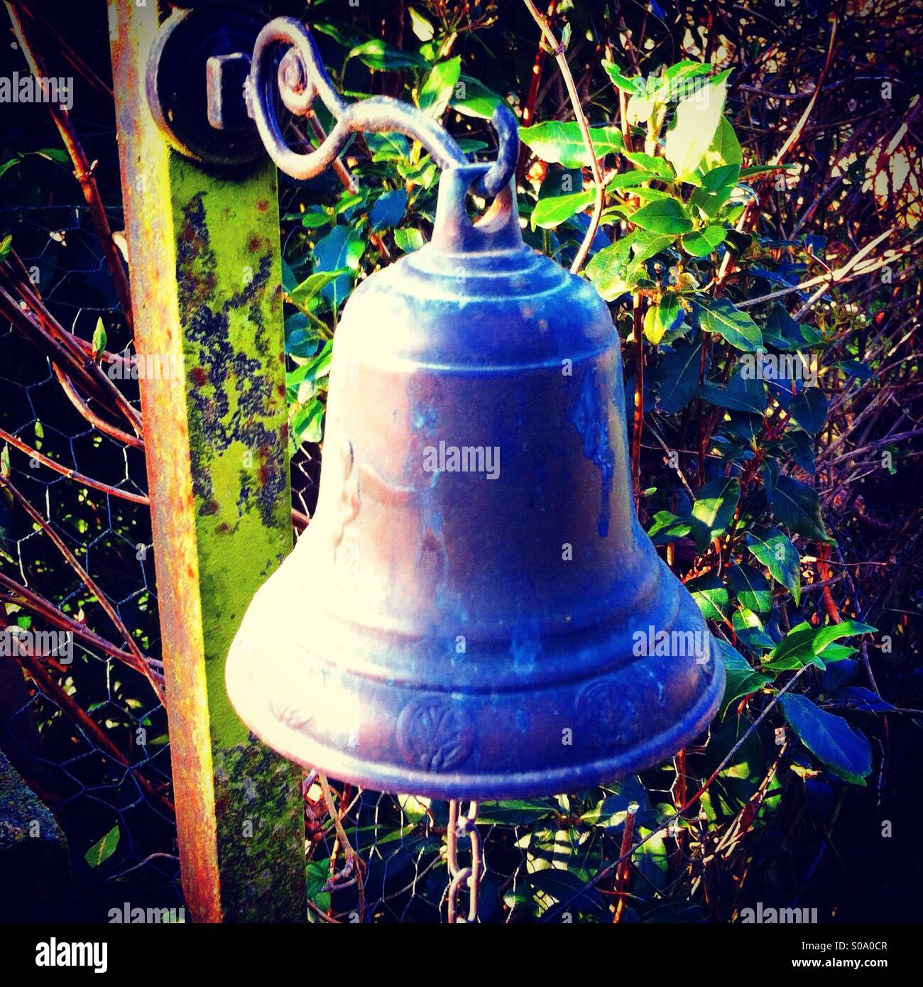 Small bell at the entrance of a farm - Smartphone Captured Stock Image